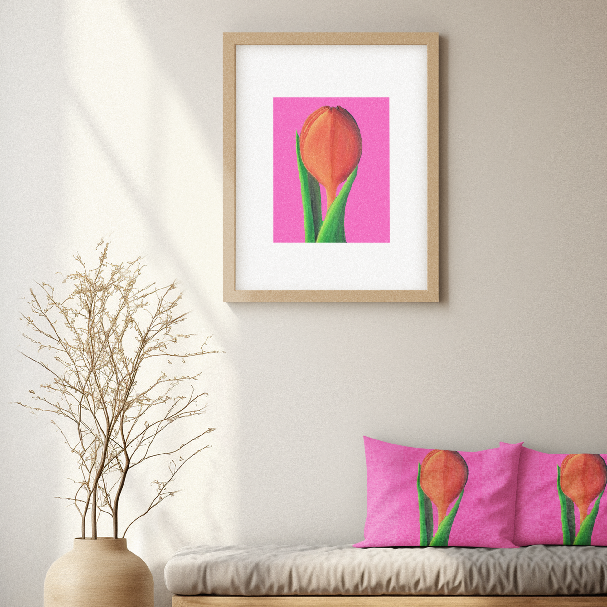 Framed artwork of tulips on a pink background in a living room setting.